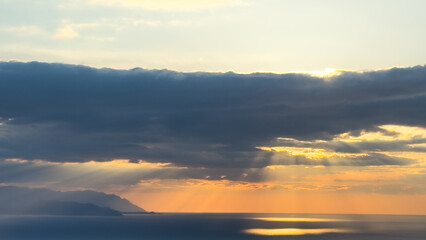 Sunset sky. Dramatic sky view. Sunlight over the sea