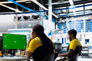Solar panels engineer overseeing energy consumption with isolated screen PC. Photovoltaics facility...
