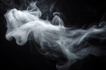 White swirling smoke billowing and twisting gracefully against a dark black background creating a mysterious and ethereal atmosphere