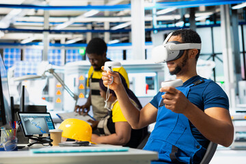 Fototapeta na wymiar Photovoltaics facility engineer using VR tech to build generators for solar cells to produce renewable energy. Industrial plant employee creates solar panel using virtual reality gear.