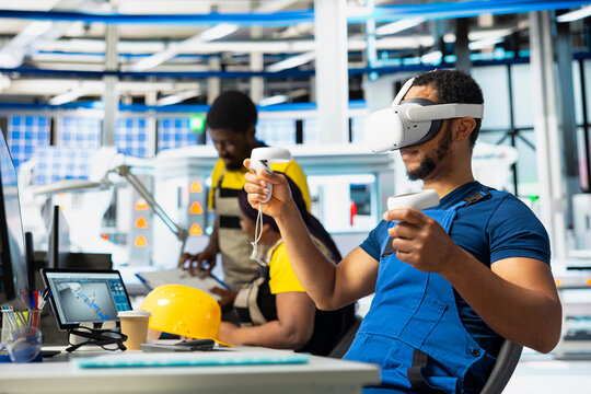Photovoltaics facility engineer using VR tech to build generators for solar cells to produce renewable energy. Industrial plant employee creates solar panel using virtual reality gear.