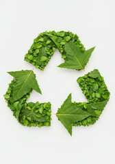 Recycling Symbol Made of Green Leaves Isolated on White Background