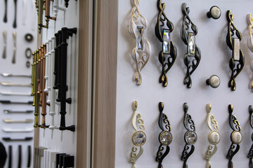 Samples of various furniture handles on display
