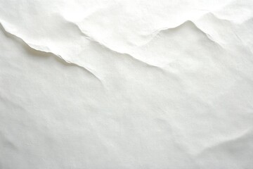 close-up view of light-colored textured paper with subtle cracks and gentle creases creating delicate shadows and highlights