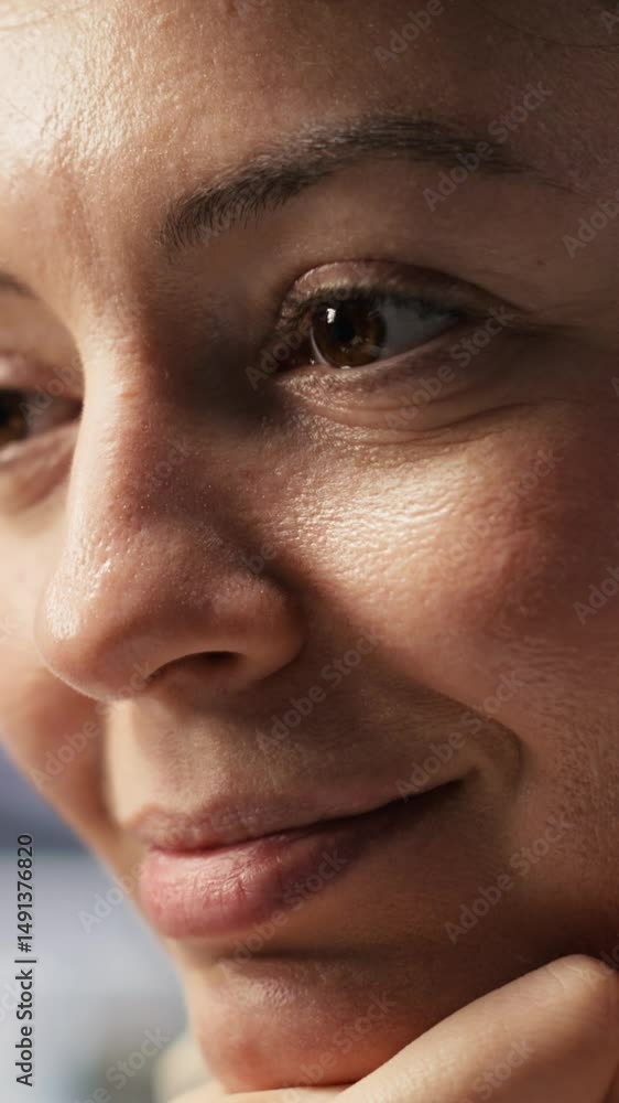 Poster vertical video extreme close up of smiling programmer monitoring server clusters performing ai train