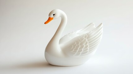 Obraz premium White swan figurine on white background.