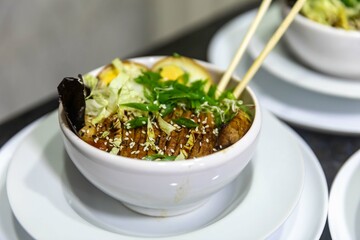 Traditional Japanese ramen or ramen with vegetable broth, grilled pork, oriental noodles and...