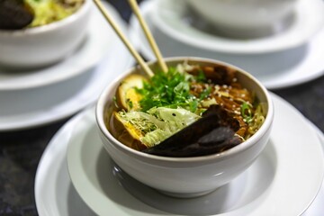 Traditional Japanese ramen or ramen with vegetable broth, grilled pork, oriental noodles and classic Japanese cuisine spices