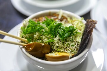 Traditional Japanese ramen or ramen with vegetable broth, grilled pork, oriental noodles and classic Japanese cuisine spices