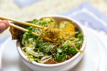 Traditional Japanese ramen or ramen with vegetable broth, grilled pork, oriental noodles and classic Japanese cuisine spices