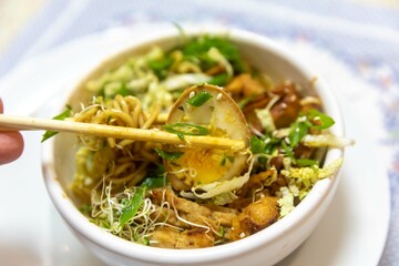 Traditional Japanese ramen or ramen with vegetable broth, grilled pork, oriental noodles and classic Japanese cuisine spices
