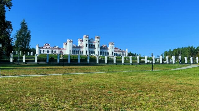 Belarus, Puslovsky Palace, September 5, 2024: Kossovsky Autumn Castle. An old historical castle in Kosovki in sunny autumn weather. An architectural monument in the style of English Neo-Gothic. 4K