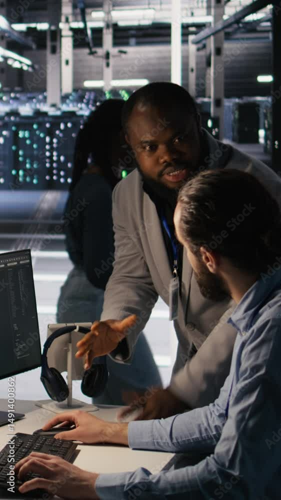 Poster vertical video server farm manager overseeing engineer examining neural network algorithms. data cen