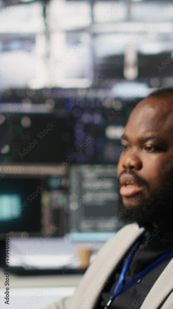Aufkleber vertical video lead data center admin overseeing it expert integrating ai in equipment rigs. african