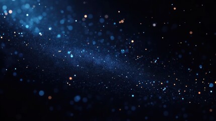 Fototapeta premium Abstract cosmic scene with glowing blue and orange particles scattered across a dark background resembling a starry galaxy