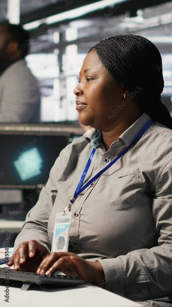 Poster vertical video data center computer scientist using pc to monitor artificial intelligence visualizat