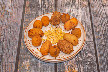  Iberian ham croquettes, with their salty strands and intense flavor, are emblematic of Spanish cuisine