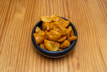 Patatas bravas are served hot as a tapa
