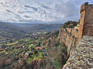 View from the Albornoz Fortress in Orvieto, Italy, showing the dramatic cliffside walls and...