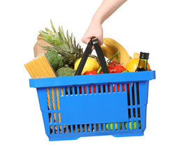 Woman holding shopping basket with different food products on white background, closeup