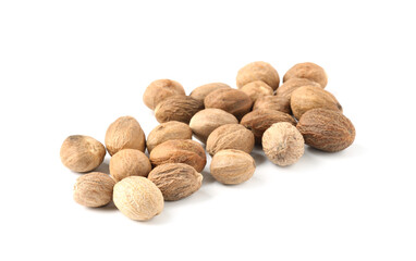 Pile of fresh nutmegs isolated on white