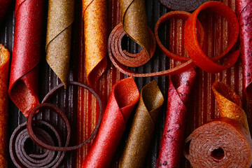 Delicious fruit leather as background, top view