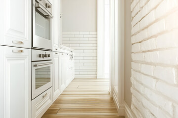 Modern white kitchen with built in oven and wood floor