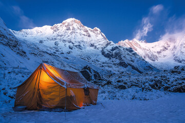Tent in the mountains on a winter night with bright moon, Annapurna Sanctuary Nepal