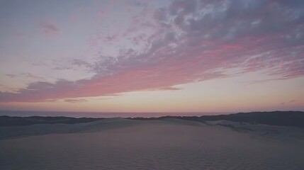 Fototapeta premium Serene coastal desert landscape at twilight under gentle pastel skies