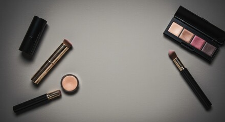 Elegant makeup arrangement on a neutral surface showcasing eyeshadows and brushes for beauty product promotion
