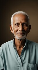 Obraz premium Portrait of elderly indian man looking at camera with gentle smile studio shot closeup view