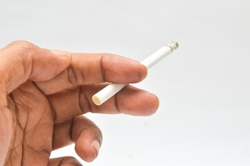 Asian man's hand holding a cigarette on a white background