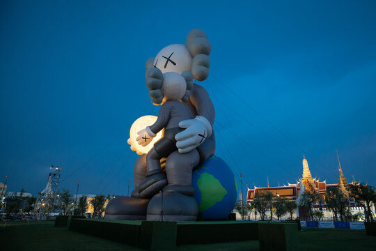 Bangkok Thailand - May 18, 2025: A large sculpture by world artist Brian Donnelly or KAWS ,The KAWS HOLIDAY Thailand exhibition is open to the public at Sanam Luang, Bangkok,