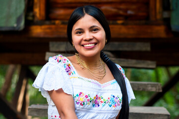 Indigenous mexican woman smiling, wearing traditional huipil dress