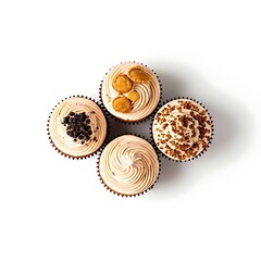 Top view of cupcakes with decorative frosting and toppings pure white background.