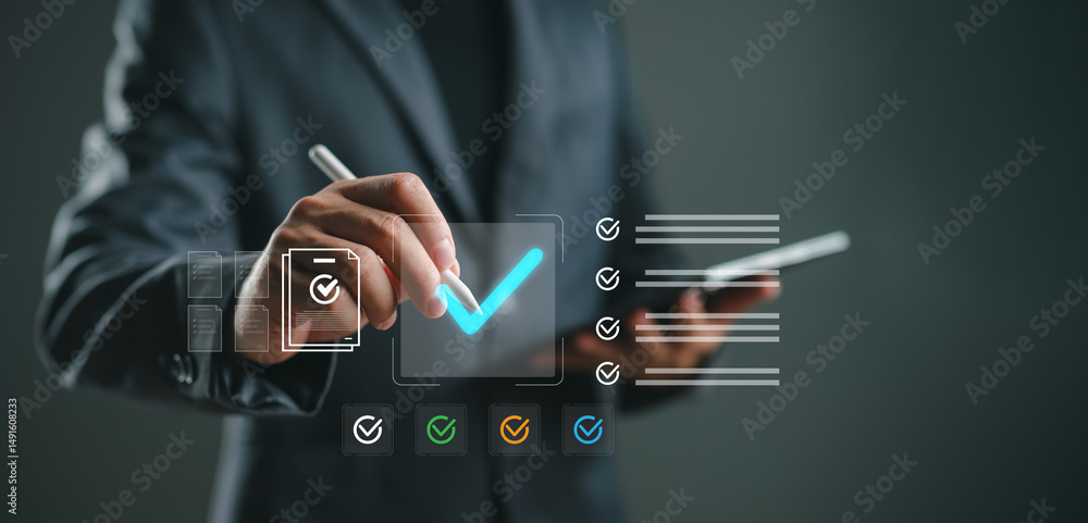 Poster quality control and task management concept. businessman using stylus to mark completed checklist on