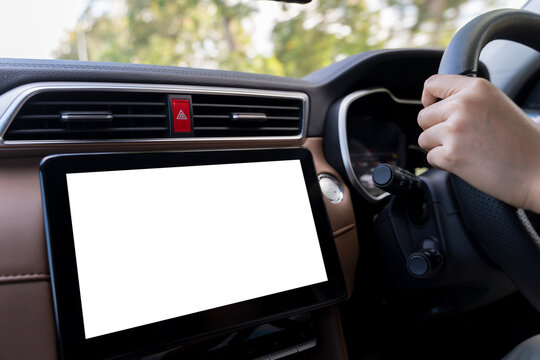 Blank car touchscreen display with driver hand on steering wheel in modern vehicle