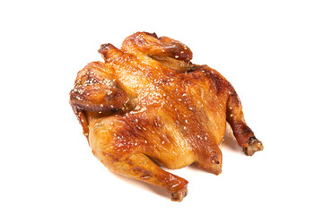 A whole delicious roasted chicken on table.