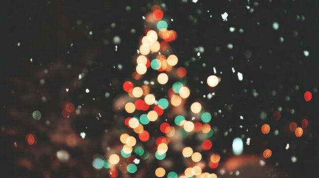 A raffia Christmas tree illuminated by warm lights with softly falling snow in a cozy evening setting.