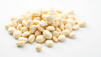 Scattered white beans on pure white background, simple, top view, studio shot