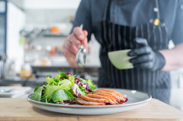 The chef serves roast duck. 