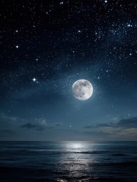 Full moon rising over dark ocean water reflecting light under a starry night sky serene nature scene