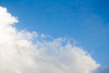 Blue sky with soft white clouds for background