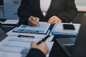 Teamwork with business people analysis cost graph on desk at meeting room. double exposure successful teamwork,business planning concept.