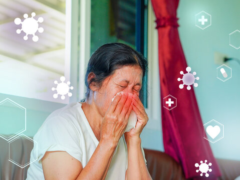 Asian senior woman using tissue to cover nose due to cold, allergies or feeling unwell. Illness, flu. Elderly patient and health care. Lifestyle wellness health care. Graphic virus, epidemic, Covid 19
