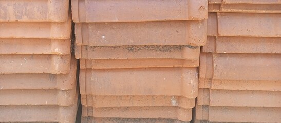 Stacked Concrete Roof Tiles with Terracotta Hue