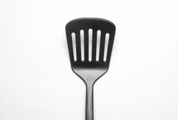 Black kitchen spatula on white background
