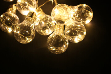 LED garland retro light bulbs on black background