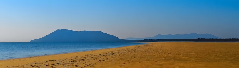 Tranquil coastal landscape with distant mountains