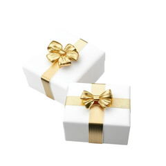 Obraz premium Elegant white gift boxes decorated with luxurious gold ribbons and bows, perfect for special occasions, celebrations, and festive gift-giving purposes.